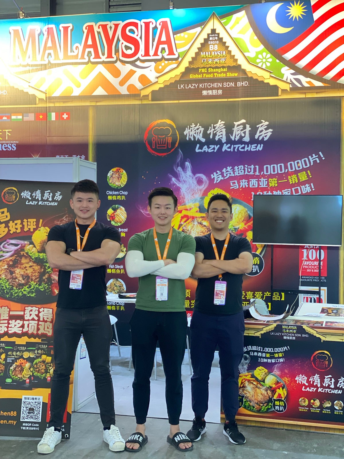 Three Lazy Kitchen team members at an international food trade show booth