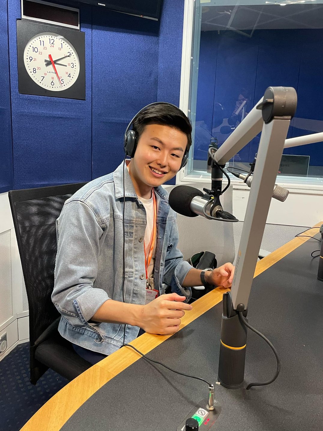 Ryan Tan in a radio studio during an interview